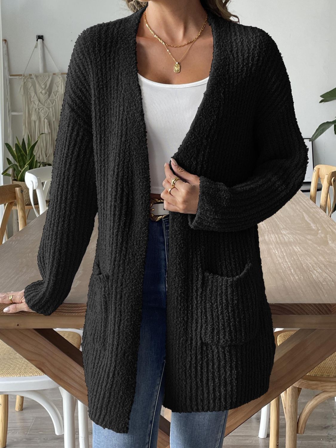 Stay warm and stylish with the Mary Cozy Long Sleeve Cardigan, a must-have for your fall and winter wardrobe. This open-front sweater features convenient pockets and offers a moderate stretch for a comfortable fit. Made from 100% polyester, it's both soft and durable. Easy to care for, just machine wash cold and tumble dry low. Perfect for layering over your favorite tops and pairing with jeans or leggings for a chic, effortless look.