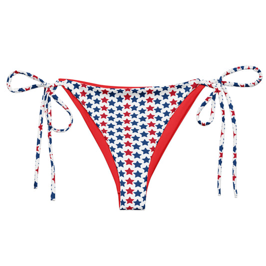 Discover our Red, White, And Stars Recycled String Bikini Bottom, a chic and sustainable swimwear option perfect for showing your patriotic spirit. Crafted from eco-friendly recycled materials, this bikini bottom features stars in vibrant colors of red and blue. Ideal for beach days or poolside lounging, its adjustable string ties ensure a perfect fit.